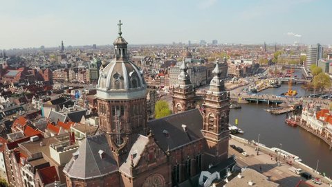Amsterdam, Netherlands. May 05, 2019. Beautiful aerial view of Amsterdam over canals near Central station and St. Nicolas Church