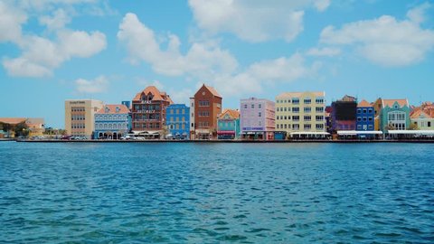 Panning wide angle shot of the beautiful world heritage buildings in Willemstad, Curacao, Caribbean