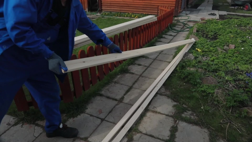 A young married couple at the ranch wants to make a table from natural boards. They refuse to use plastic. They discuss the quality of the boards and carry them to the place where the table is made.