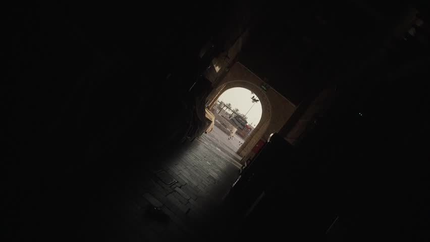 Smooth slow-motion roll camera movement through Souq Waqif in Doha, Qatar