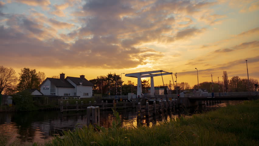 Timelapse of the sunset in small village in The Netherlands, Eembrugge. Mid April, spring, wamer days, still cold nights.