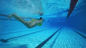 Underwater woman swimming  in pool