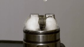 Closeup Dripping E Juice on a E Cig electric Cigarette, Vape Mod