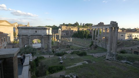 Italy, Rome - September, 2016: Temple of Saturn and Arch of Septimius Severus at the Roman Forum.
