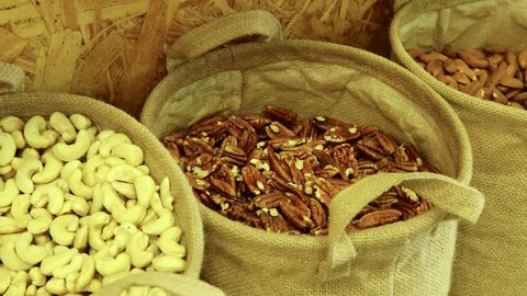 Buying Pecan nuts at the natural food store for a healthy vegan breakfast shake diet