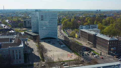 Tallinn / ESTONIA - April 29, 2019: Aerial overview of Estonian superministry building and its main court. Shot during rush hour traffic