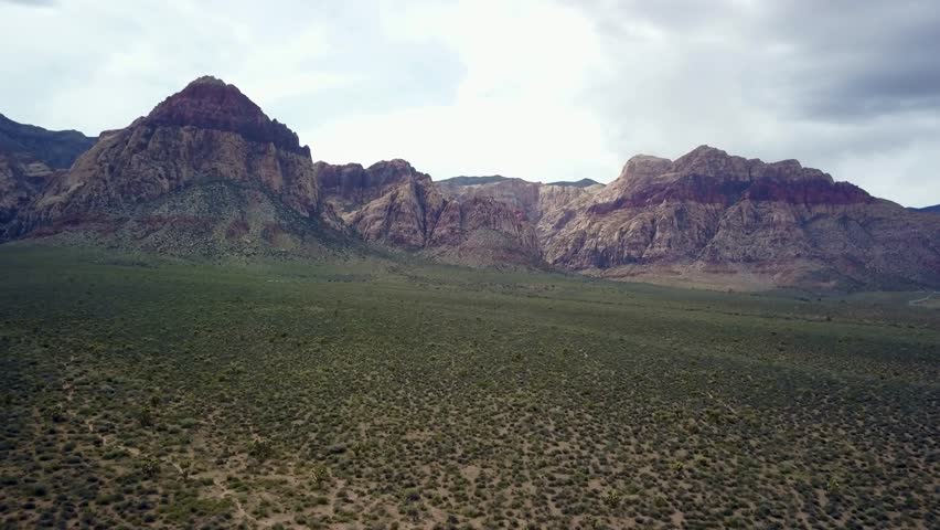 Aerial slow push into mountains around Red Rock Canyon near Las Vegas Nevada