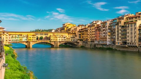 Florence, Tuscany, Italy. Time lapse of The Ponte Vecchio ("Old Bridge") is a medieval stone closed-spandrel segmental arch bridge over the Arno River.  Zoom effect