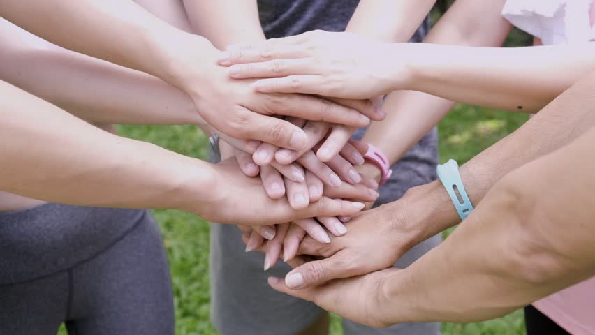 Group of young asian man and woman in sport outfit holding hands for team work. | Shutterstock HD Video #1029329645
