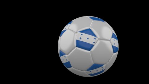 Soccer ball with the flag of Honduras flies past the camera, slow motion, 4k footage with alpha channel