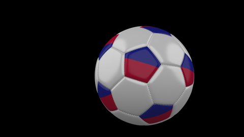 Soccer ball with the flag of Haiti flies past the camera, slow motion, 4k footage with alpha channel