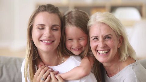European family 3 generations mother little daughter aged grandmother portrait, close up faces happy laughing relative people pretty women at home, have fun, spend time together care and love concept