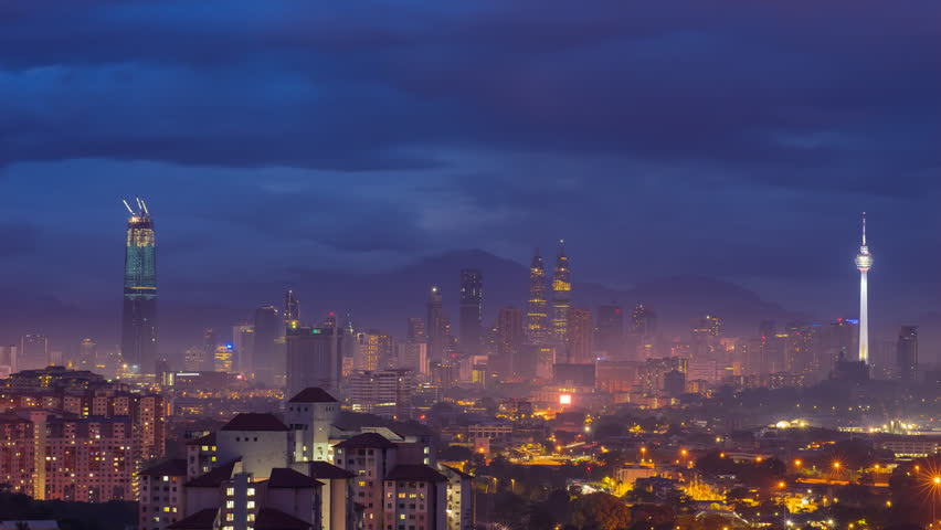 Time lapse: Beautiful and dramatic first light sunset view of Kuala Lumpur city skyline from afar and high angle in Malaysia. | Shutterstock HD Video #1029338183
