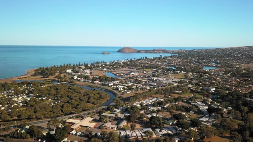 Scenic Aerial view of Victor Harbor, a beautiful town, laying at the sea with natural environment.