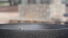 Red hot chili flakes falling in slow motion into a steaming pot - Powered by Shutterstock - Get 15% off with code: PIKWIZARD15