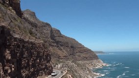 HD high quality summer day footage of spectacular scenic Chapman's Peak Drive, rocky mountains, Atlantic Ocean views between Hout Bay and Noordhoek in Western Cape near Cape Town, South Africa