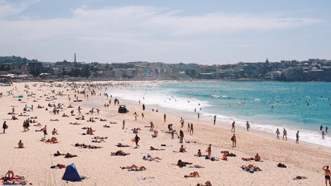 People relaxing and sunbathing at Bondi beach in Sydney, Australia