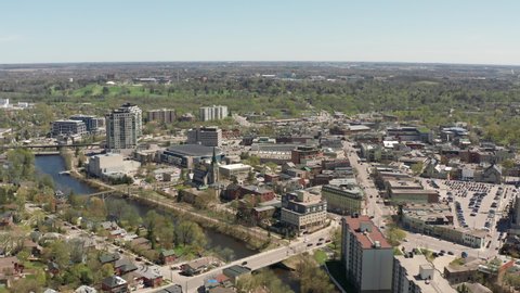 Guelph Ontario Canada 4k Aerial Drone of Downtown Main Street and Surrounding Area, River and Cityscape. Wide Skyline Shot of City Showcasing Entire Town During Sunny Day