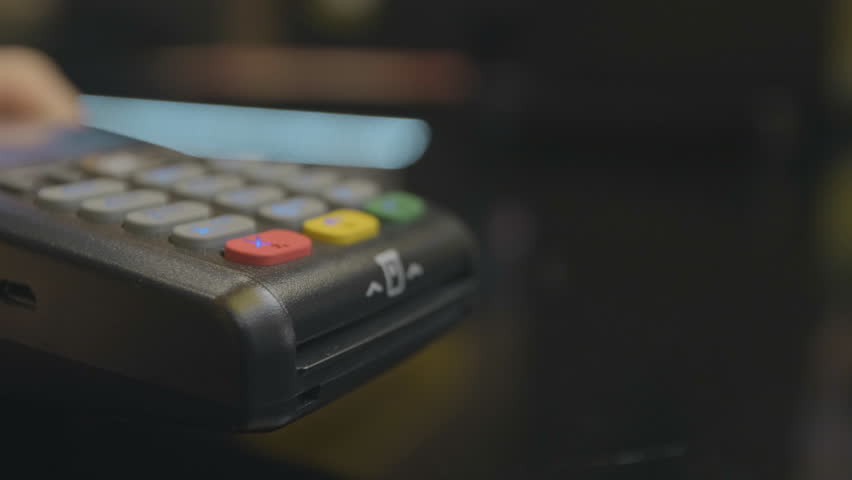 Credit card machine for money transaction. Man hand with credit card swipe through pos terminal and enter pin code. Banking services of electronic money. Financial success and safety. | Shutterstock HD Video #1029403976