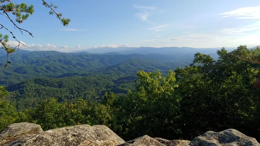 A view of the Great Smoky Mountains National Park filmed on a rock cliff in the Foothills Parkway located in the Smoky Mountains