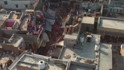 Color battle at the holi festival in India, 4k aerial shot 