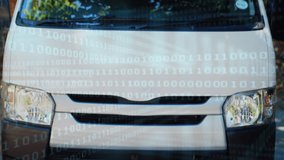 Close up of a deliveryman giving a thumbs up while carrying a package. Behind him is a parked delivery van. Digital animation of binary codes are running in the foreground - Powered by Shutterstock - Get 15% off with code: PIKWIZARD15