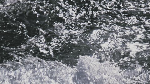 Clear water of River close up. Slow motion.