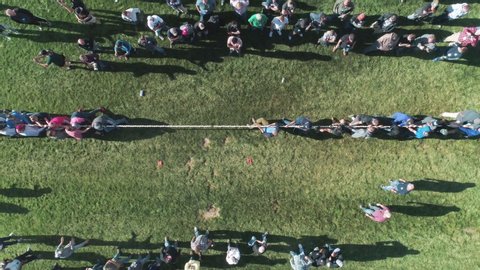 Aerial View of Large Teams Playing Tug O' War