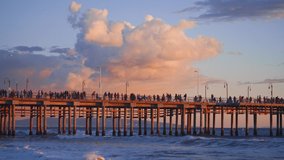 People on the Santa Monica pier at sunset