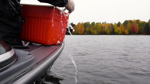 Iron River, Michigan / United States - 10 08 2018: Walleye release restocking an Upper Peninsula, inland lake during the fall colors in Michigan.