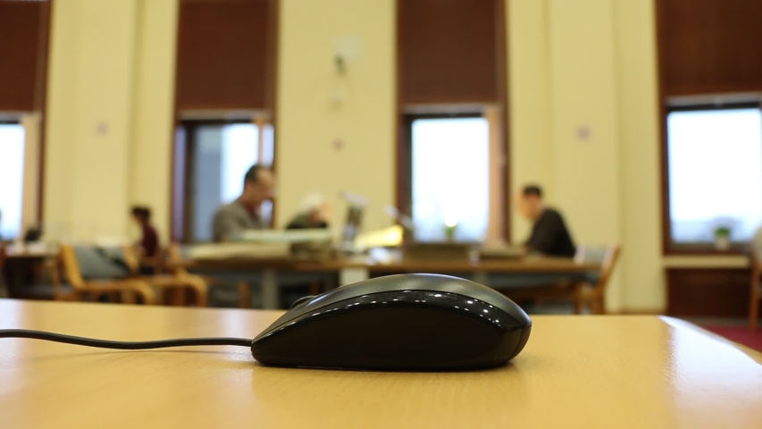 computer mouse on the table in the library