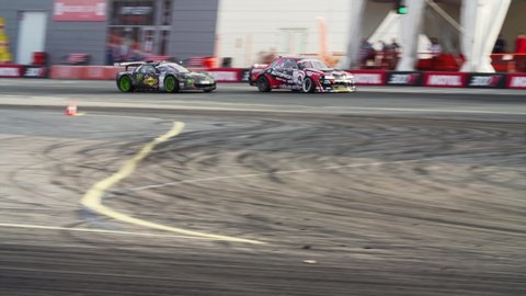 VLADIVOSTOK, RUSSIA - SEPTEMBER 16, 2018: Two stylish racing cars take part in Asia Pacific D1 Primring GP, International drifting race