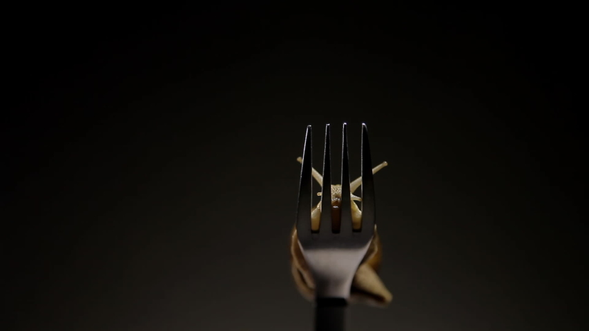 Grape snail crawling on a fork