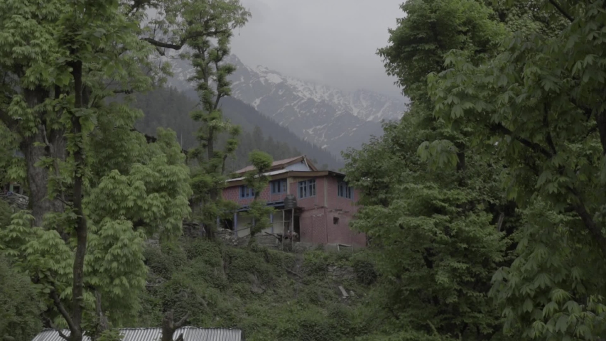 indian house inside of the village with the Himalayas