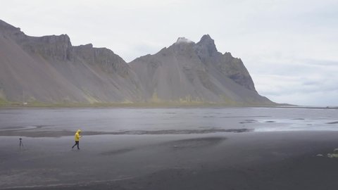 HD - Man Walking in Black Sand Beach in Iceland - In Iceland