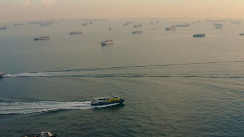 Aerial shot of ships at anchorage, Singapore at sunset