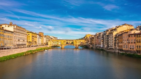 Florence, Tuscany, Italy. Time lapse of The Ponte Vecchio ("Old Bridge") is a medieval stone closed-spandrel segmental arch bridge over the Arno River. Zoom efffect