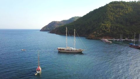 Flying over the sail yachts in Ekincik Bay; One of the most well known departure and arrival points for Blue Cruise Tours. A fantastic experience between swimming and eating. High angle view
