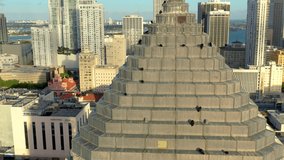 MIAMI, FLORIDA, USA - MAY 2019: Aerial drone view flight over Miami downtown. Business building rooftop with birds from above.