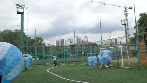 DNIPRO, UKRAINE-May 10, 2019: People play bumperball zorbsoccer outdoor. party time, May 10 2019 in Dnipro Ukraine