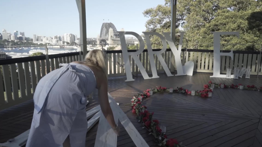 A lady is arranging letters together