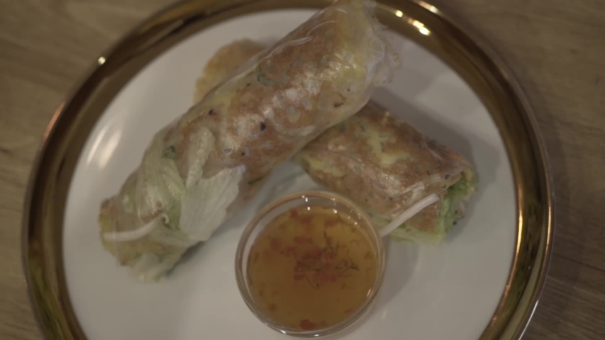 Vegetable rolled food and sauces on the table 
