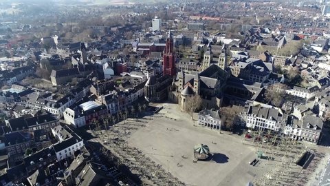 Aerial view from helicopter of the Vrijthof is large urban square in the centre of Maastricht Netherlands it is surrounded by important heritage buildings like the Saint John's red tower St. Servatius