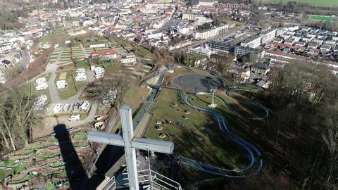Aerial view of watch tower located at Valkenburg aan de Geul is a municipality situated in the southeastern Dutch province of Limburg also showing the camping ground and toboggan run 4k quality