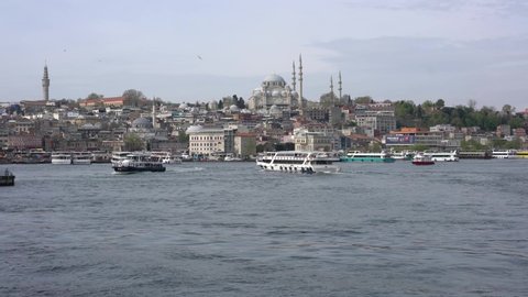 Istanbul / Turkey - May 3 2019 : Panorama of Istanbul, with the view of Suleymaniye Mosque, boats and Eminonu region, Turkey
