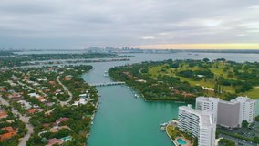 MIAMI, FLORIDA, USA - MAY 2019: Aerial drone view flight over Miami Biscayne Bay and Indian Creek island. Luxury houses, boats and yachts from above.