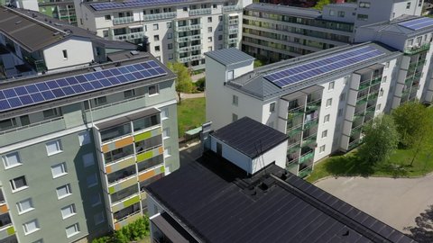 Aereal view of solar panels on the rooftops of house complexes in Stockholm, Sweden