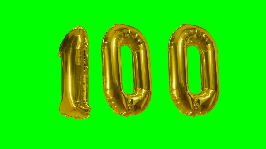 Number 100 one hundred years birthday anniversary golden balloon floating on green screen