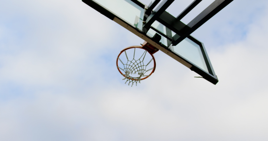 Low angle view of Caucasian basketball player playing basketball in basketball court 4k Royalty-Free Stock Footage #1029607775