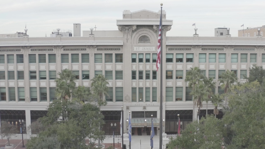 City Hall building with american flag government looking building with trees aerial downtown Jacksonville St James